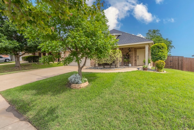 1100 Thicket Dr, Mansfield, TX 76063 - view of property hidden behind natural elements with driveway, a shingled roof, an attached garage, and brick siding