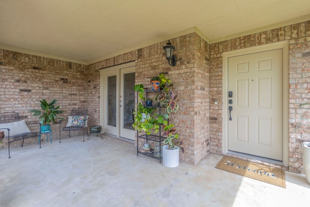 1100 Thicket Dr, Mansfield, TX 76063 - view of exterior entry featuring brick siding