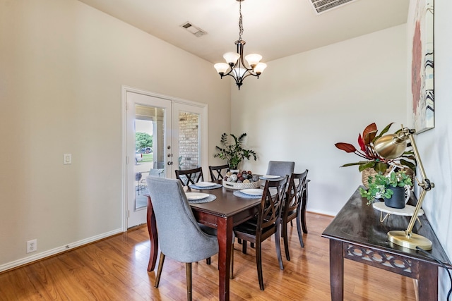 1100 Thicket Dr, Mansfield, TX 76063 - dining room featuring light wood finished floors, a chandelier, and baseboards