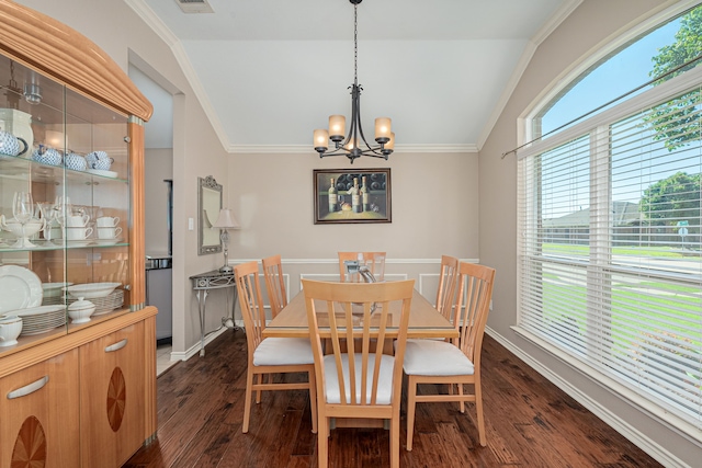 dining area with a chandelier, vaulted ceiling, dark wood-type flooring, and ornamental molding