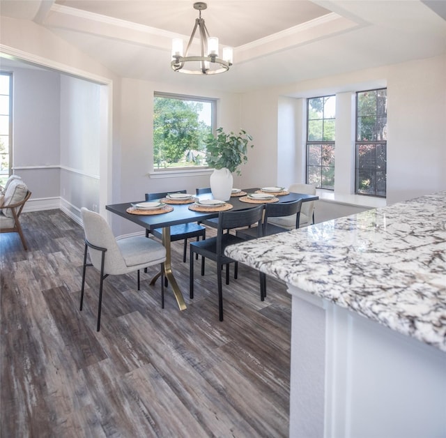 102 Camino Real W, Wylie, TX 75098 - dining space with dark wood finished floors, a chandelier, and baseboards
