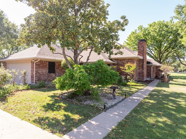 102 Camino Real W, Wylie, TX 75098 - view of front of home with brick siding, a front yard, a chimney, roof with shingles, and an attached garage