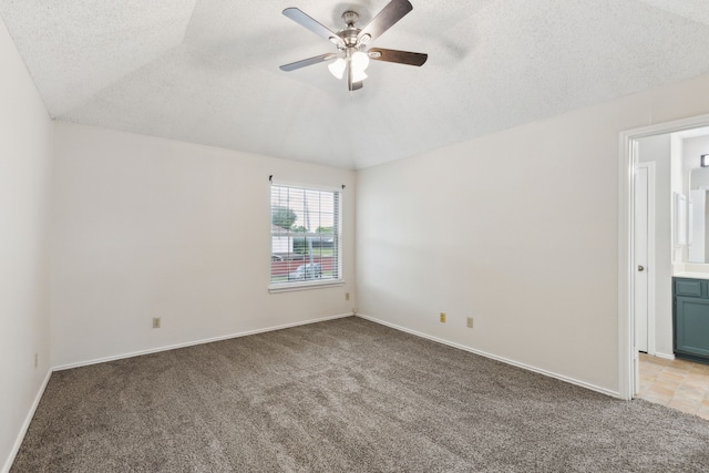 3516 Napolean Ct, Plano, TX 75023 - spare room featuring light carpet, a textured ceiling, ceiling fan, vaulted ceiling, and baseboards
