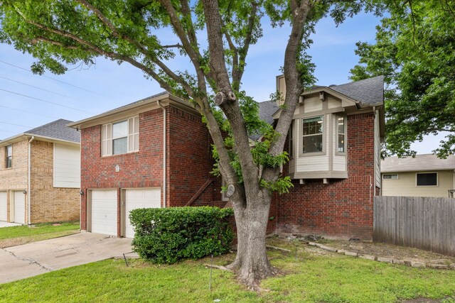 3516 Napolean Ct, Plano, TX 75023 - view of front facade with an attached garage, brick siding, concrete driveway, and roof with shingles