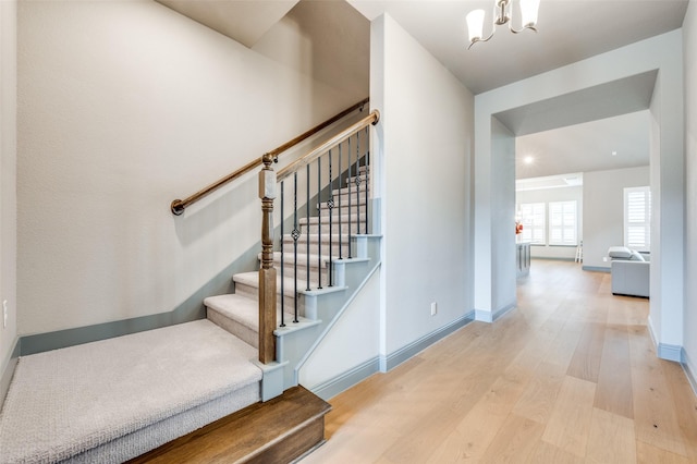 1930 Inwood Ln, Prosper, TX 75078 - staircase featuring wood finished floors, a chandelier, and baseboards