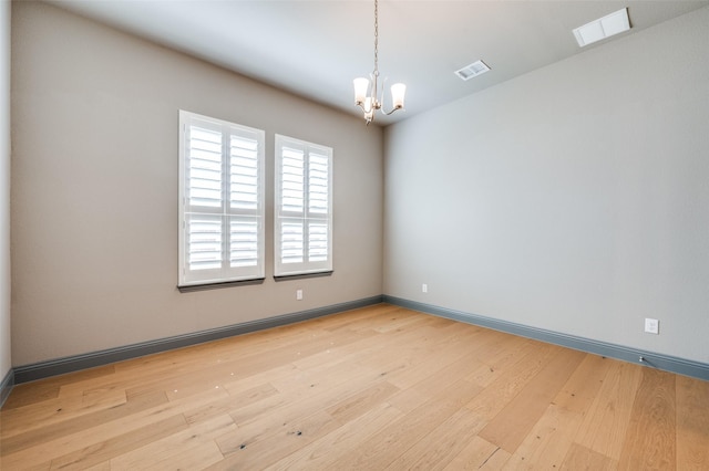 1930 Inwood Ln, Prosper, TX 75078 - unfurnished room with a chandelier, light wood-style flooring, and baseboards