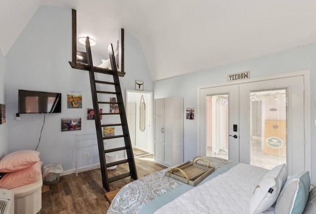 bedroom with wood finished floors, high vaulted ceiling, and baseboards