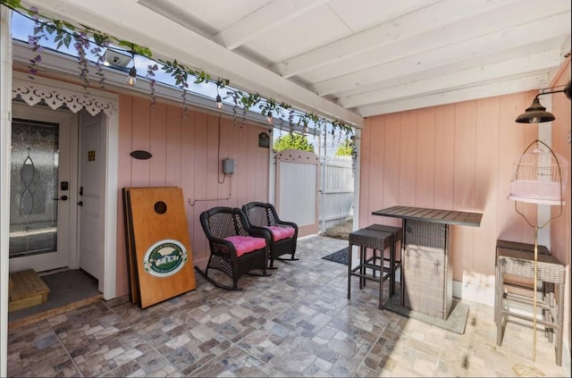 view of patio featuring fence