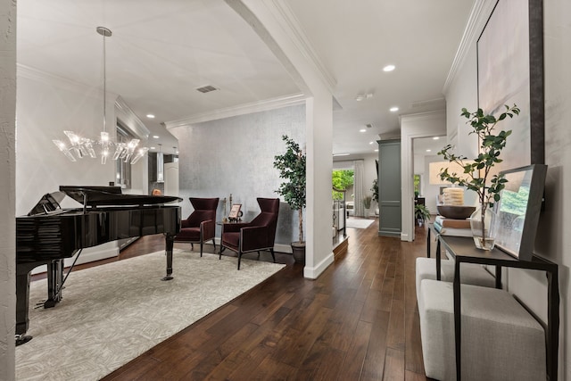 entrance foyer featuring dark wood finished floors, crown molding, recessed lighting, a chandelier, and baseboards
