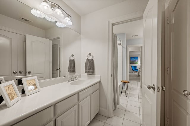 bathroom featuring tile patterned floors and vanity