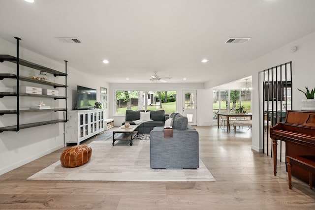 living area with recessed lighting, wood finished floors, baseboards, a chandelier, and ceiling fan