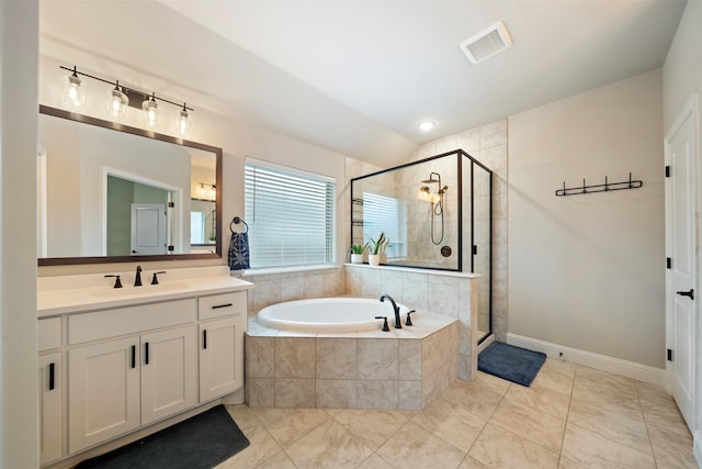 bathroom with a bath, a stall shower, vanity, lofted ceiling, and baseboards