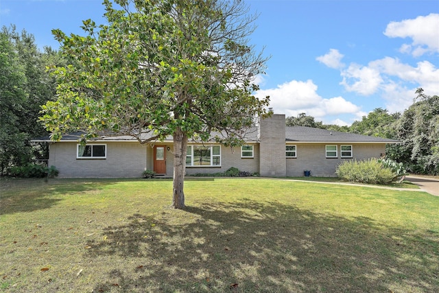 3601 Orchard Ln, Waco, TX 76705 - view of front of house with a front lawn, brick siding, and a chimney