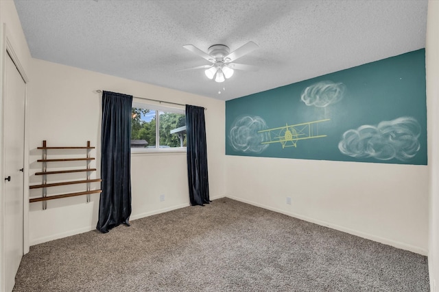 3601 Orchard Ln, Waco, TX 76705 - empty room with ceiling fan, carpet, a textured ceiling, and baseboards