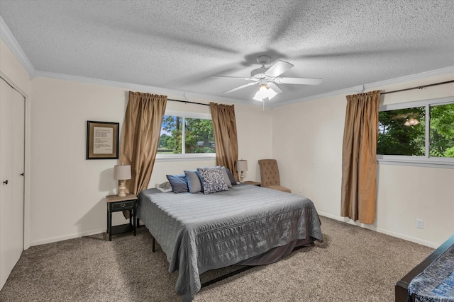 3601 Orchard Ln, Waco, TX 76705 - carpeted bedroom with multiple windows, ornamental molding, a textured ceiling, baseboards, and a ceiling fan