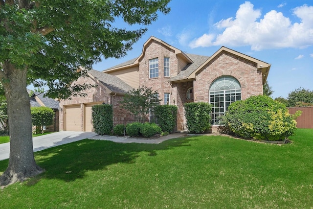 traditional-style home featuring brick siding, driveway, a front lawn, and an attached garage