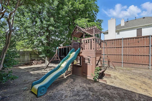 view of play area with a fenced backyard