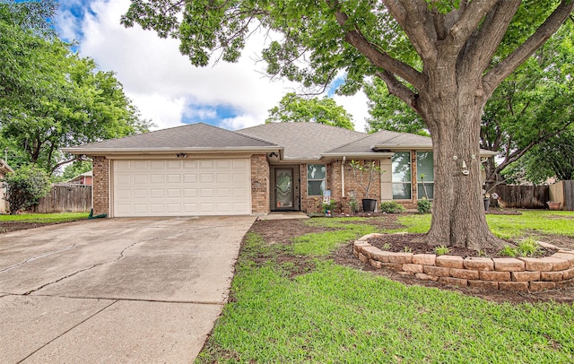view of front facade featuring an attached garage, driveway, brick siding, and roof with shingles
