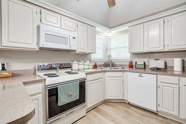 kitchen with white appliances, light wood-style floors, a sink, a ceiling fan, and white cabinetry