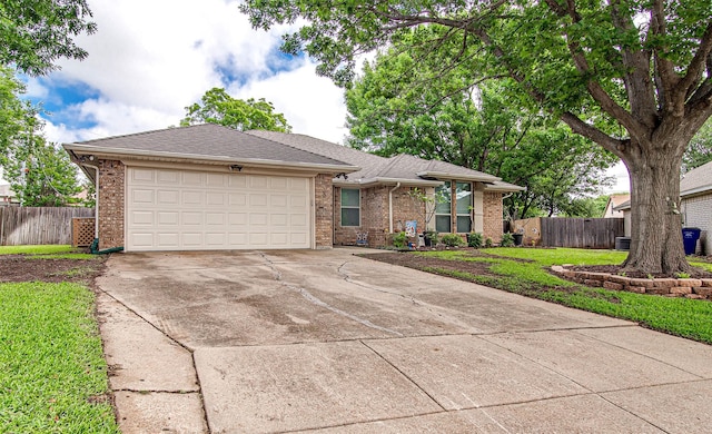 ranch-style home with an attached garage, driveway, brick siding, and roof with shingles