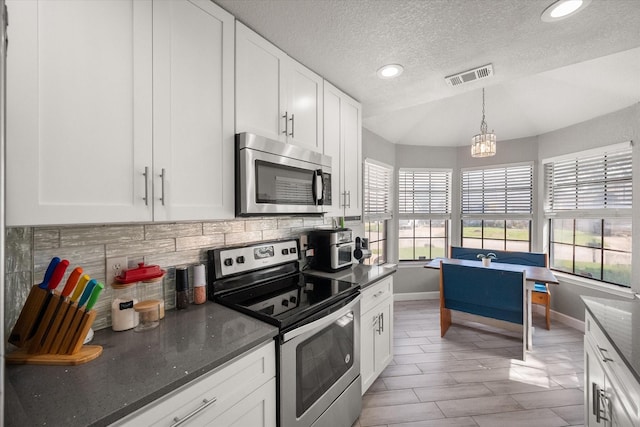 4677 Bracken Dr, Fort Worth, TX 76137 - kitchen with appliances with stainless steel finishes, baseboards, decorative backsplash, white cabinets, and recessed lighting