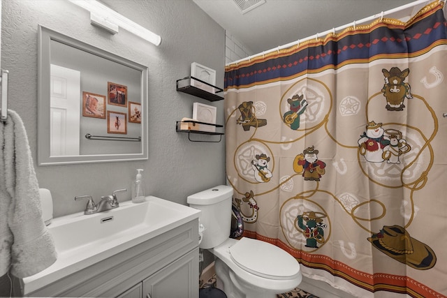 4677 Bracken Dr, Fort Worth, TX 76137 - full bath with a textured wall, toilet, vanity, and curtained shower