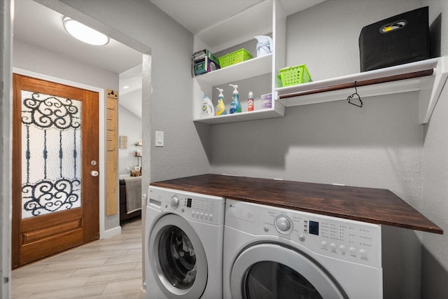 4677 Bracken Dr, Fort Worth, TX 76137 - laundry room with washer and clothes dryer, light wood finished floors, and baseboards