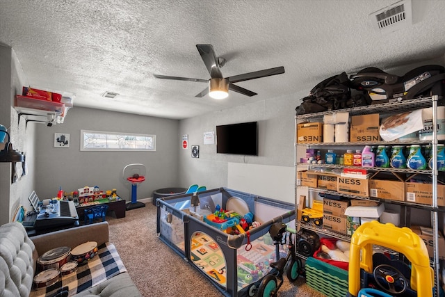 4677 Bracken Dr, Fort Worth, TX 76137 - rec room featuring a ceiling fan, carpet floors, and a textured ceiling