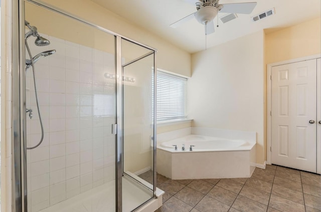 8431 Firewheel Ln, Frisco, TX 75036 - full bathroom featuring a ceiling fan, a garden tub, a shower stall, and tile patterned floors