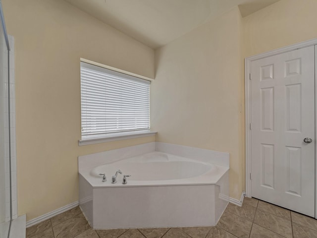 8431 Firewheel Ln, Frisco, TX 75036 - full bath with a garden tub, baseboards, and tile patterned flooring