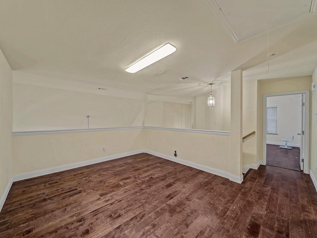 8431 Firewheel Ln, Frisco, TX 75036 - unfurnished room featuring attic access, dark wood finished floors, and baseboards