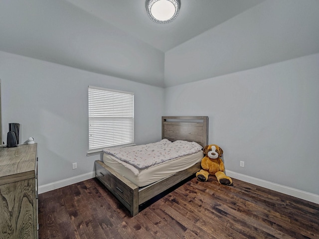 8431 Firewheel Ln, Frisco, TX 75036 - bedroom with dark wood-type flooring, baseboards, and lofted ceiling