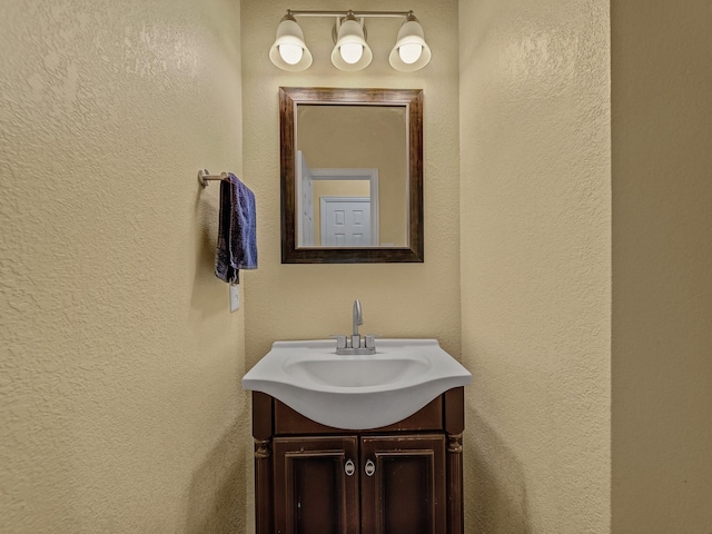 8431 Firewheel Ln, Frisco, TX 75036 - bathroom with vanity and a textured wall