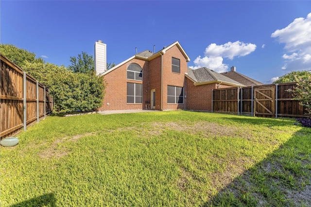 8431 Firewheel Ln, Frisco, TX 75036 - rear view of property featuring a chimney and brick siding