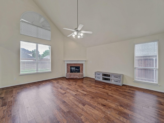 8431 Firewheel Ln, Frisco, TX 75036 - unfurnished living room with ceiling fan, wood finished floors, a fireplace, high vaulted ceiling, and baseboards