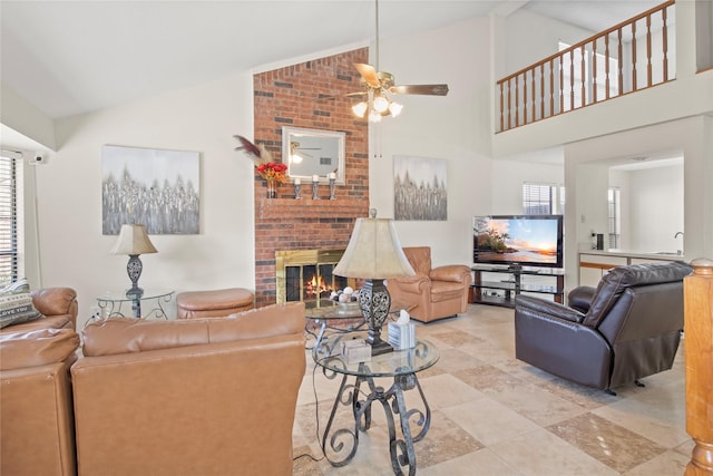1008 Hemlock Ct, Coppell, TX 75019 - living room featuring plenty of natural light, a fireplace, high vaulted ceiling, a ceiling fan, and light tile patterned floors