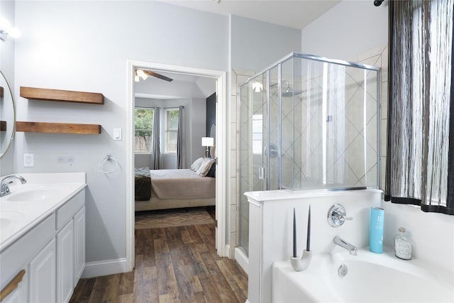 2812 Arabian Ln, Celina, TX 75009 - ensuite bathroom featuring a garden tub, ceiling fan, a shower stall, and wood finished floors