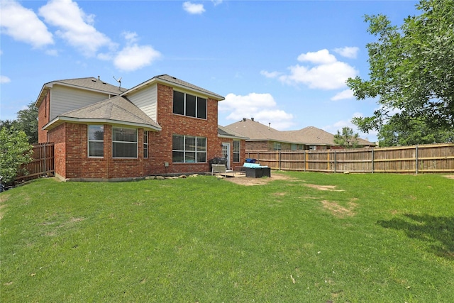 2812 Arabian Ln, Celina, TX 75009 - back of property with brick siding, a shingled roof, and a patio