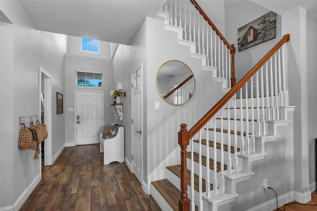 2812 Arabian Ln, Celina, TX 75009 - entrance foyer with wood finished floors, a high ceiling, stairway, and baseboards