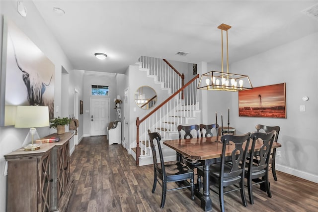 2812 Arabian Ln, Celina, TX 75009 - dining area with stairs, dark wood finished floors, baseboards, and a chandelier