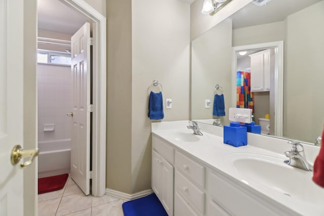 bathroom featuring toilet, tile patterned flooring, double vanity, and a shower with curtain