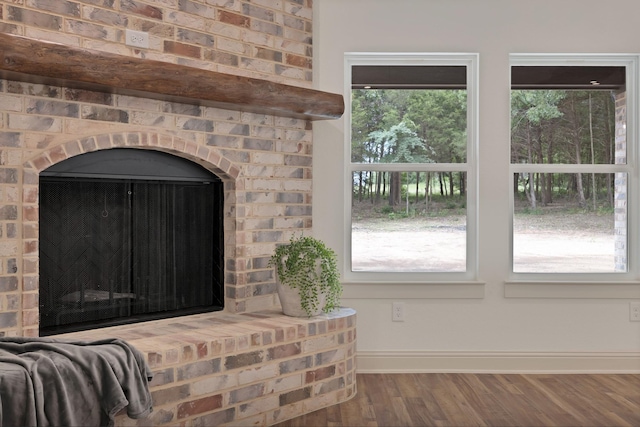 164 Vz County Road 2433, Canton, TX 75103 - detailed view of baseboards, wood finished floors, and a brick fireplace