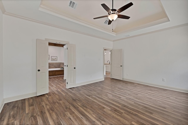 164 Vz County Road 2433, Canton, TX 75103 - unfurnished bedroom with a tray ceiling, crown molding, wood finished floors, and baseboards
