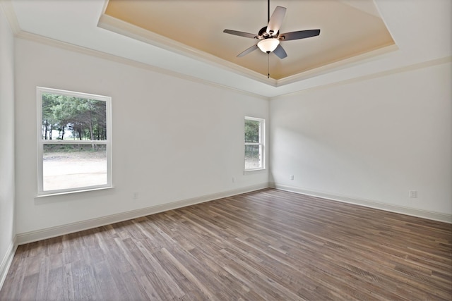 164 Vz County Road 2433, Canton, TX 75103 - unfurnished room with a raised ceiling, plenty of natural light, crown molding, and wood finished floors