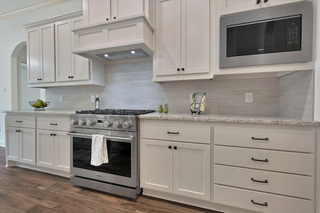 164 Vz County Road 2433, Canton, TX 75103 - kitchen featuring stainless steel appliances, premium range hood, decorative backsplash, and white cabinetry