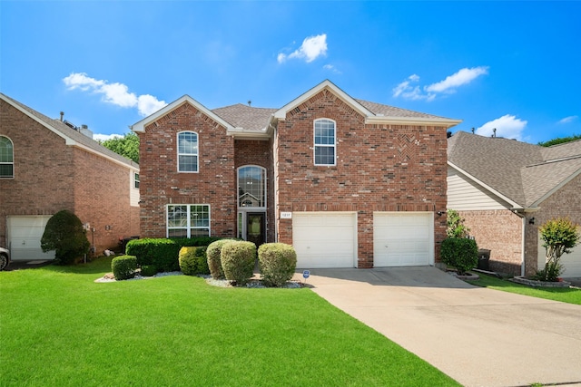 1217 Mackey St, Garland, TX 75040 - traditional home with concrete driveway, brick siding, a front lawn, an attached garage, and a shingled roof