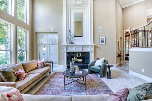 1900 Pembroke Ln, Mckinney, TX 75072 - living room with a high ceiling, stairs, ornamental molding, baseboards, and a high end fireplace