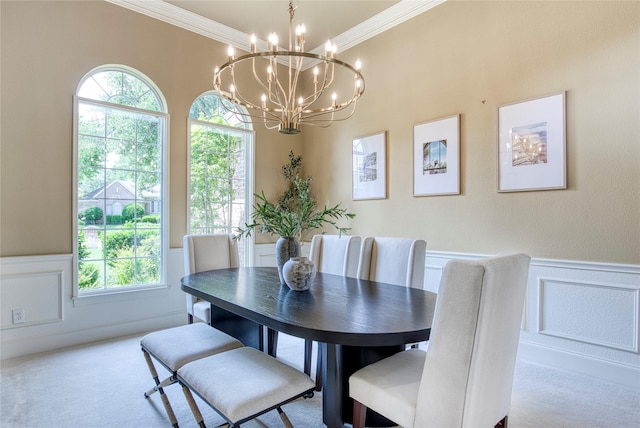 1900 Pembroke Ln, Mckinney, TX 75072 - carpeted dining area with a decorative wall, wainscoting, crown molding, and a chandelier