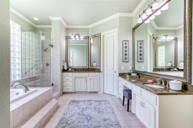 1900 Pembroke Ln, Mckinney, TX 75072 - bathroom featuring a shower stall, a garden tub, two vanities, tile patterned floors, and crown molding