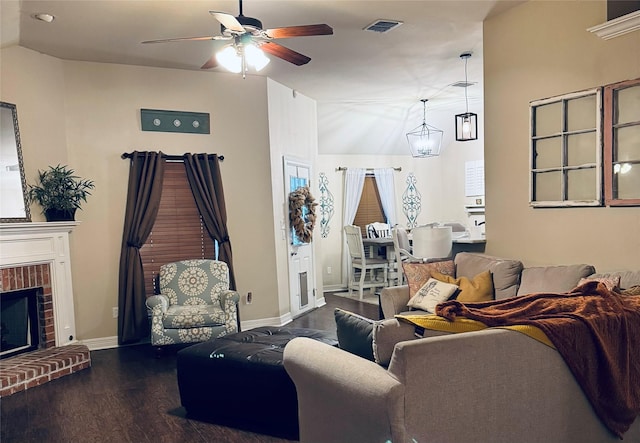 10159 English Oaks Dr, Keithville, LA 71047 - living room with ceiling fan, wood finished floors, baseboards, and a brick fireplace